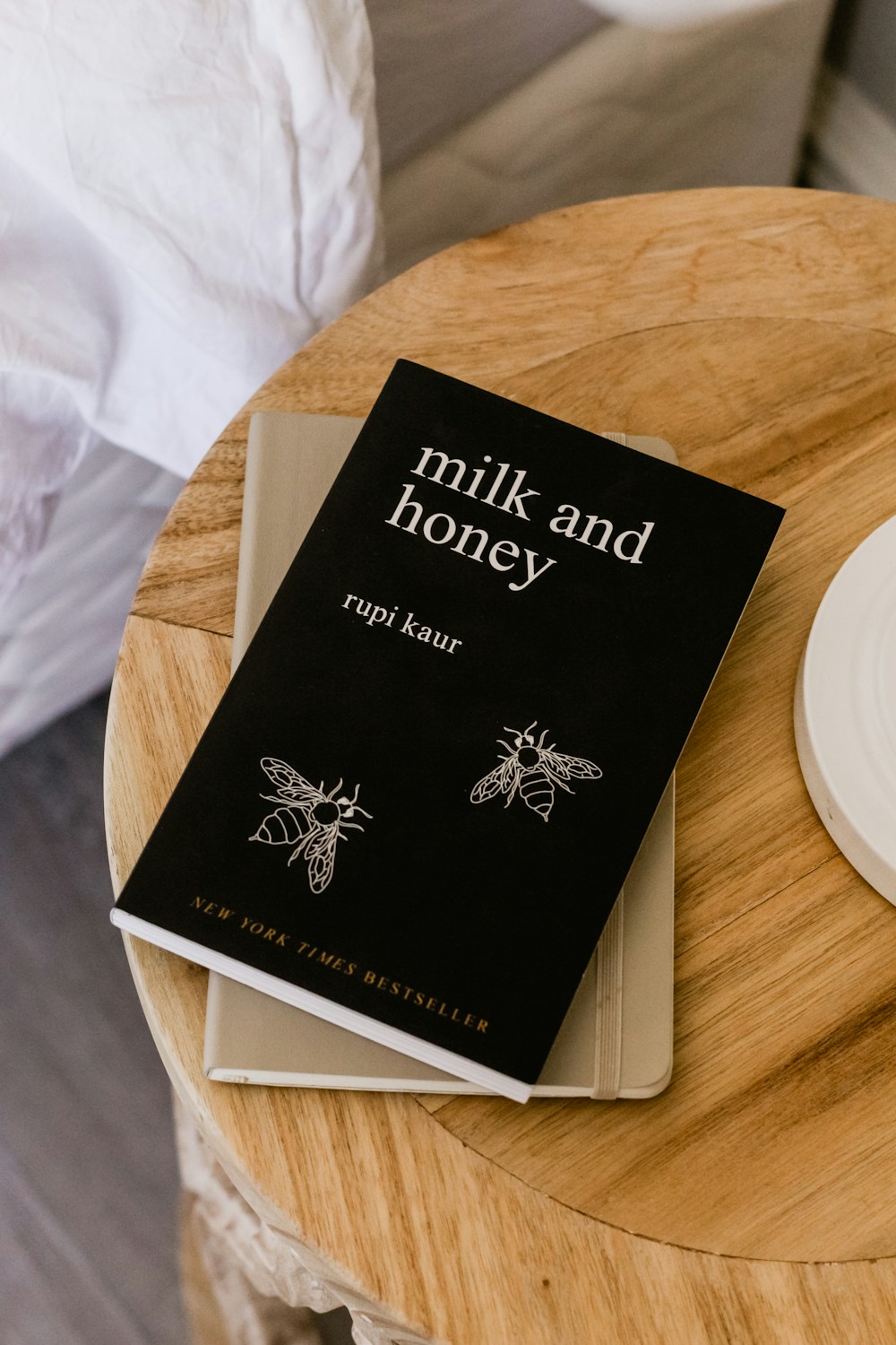Open paperback on a quiet table — pages waiting on the shelf
